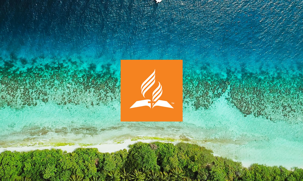 church logo superimposed over aerial view of island lagoon